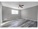 Bedroom featuring wood-look floors, a modern ceiling fan, and a bright window at 4701 Flat Shoals Rd # 49C, Union City, GA 30291