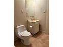 Cozy bathroom features a sink with cabinet, and a toilet at 1415 Dodson Sw Dr, Atlanta, GA 30311