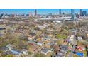 Expansive aerial view showcasing the neighborhood, city skyline and the Mercedes-Benz Stadium at 160 Vine Nw St, Atlanta, GA 30314