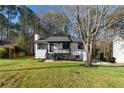 Charming renovated home with lush green lawn and professional landscaping at 2735 Varlet Ct, Snellville, GA 30039