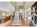 Grand foyer with hardwood floors, staircase, and view of dining room at 2138 Jockey Hollow Nw Dr, Kennesaw, GA 30152