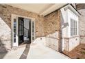 Elegant front entrance featuring sidelights, transom, and a view of the foyer at 1300 Winfair Ne Ln, Brookhaven, GA 30329