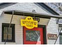 Close-up of 'Westview 1683' signage near the red front door, highlighting address at 1683 Emerald Sw Ave, Atlanta, GA 30310