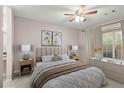 Bright bedroom with a ceiling fan and large window, creating a serene retreat at 3655 Habersham Ne Rd # 215, Atlanta, GA 30305