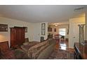 Open-concept living room with hardwood floors leading to the kitchen area at 47 Monet Nw Ct, Atlanta, GA 30327