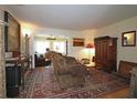 Cozy living room with ornate rugs and a decorative fireplace at 47 Monet Nw Ct, Atlanta, GA 30327
