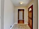 View of front entrance with view to hall and wood flooring at 1450 Pinyon Pl, Lawrenceville, GA 30043