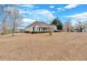 Well-maintained single-story home with green lawn and a neatly trimmed front yard at 251 Bent Creek Dr, Dallas, GA 30157