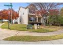Street view of home exterior with manicured lawn, trees, and neighborhood at 2450 Mildon Hall Ln, Lawrenceville, GA 30043