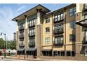 Modern apartment complex showcasing multiple levels, brick accents, and balconies on a sunny day at 5300 Peachtree Rd # 2309, Chamblee, GA 30341