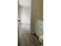 Open view of the bathroom leading to the bedroom with modern fixtures and finishes at 72 Belmonte Sw Cir, Atlanta, GA 30311