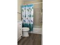 Charming full bathroom with tile-surround tub and shower, and updated vanity at 72 Belmonte Sw Cir, Atlanta, GA 30311