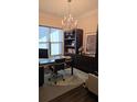 A stylish home office featuring built-in shelves, a modern desk, an ergonomic chair and lots of natural light at 112 Austin Dr, Sandy Springs, GA 30328