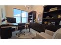 A stylish home office featuring built-in shelves, a modern desk, an ergonomic chair and lots of natural light at 112 Austin Dr, Sandy Springs, GA 30328