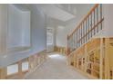 Unfinished staircase with wooden steps and wrought iron railing in a home under construction at 1632 Caswell Pkwy # 8, Marietta, GA 30060