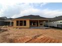 Back exterior of a house during construction with exposed wood framing and no siding at 2044 Ripple Park Bnd, Canton, GA 30114