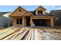 Exterior view of a house during construction with exposed wood framing and no siding at 2044 Ripple Park Bnd, Canton, GA 30114