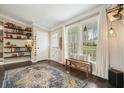 Entryway with shelves, natural light, and decorative rug, creating a warm and inviting atmosphere at 411 Buckingham Cir, Marietta, GA 30066