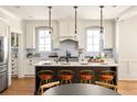 Bright kitchen features stainless steel appliances, stylish countertops, and a large central island at 263 Mathews Ne Ave, Atlanta, GA 30307