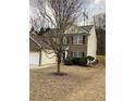 Attractive home with vinyl siding and brick accents, complemented by a well-kept lawn and mature trees at 2546 Tullamore Cir, Snellville, GA 30039