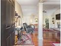Elegant living room featuring hardwood floors, open floorplan, and a fireplace at 1874 Manor View Nw Cir # 4, Acworth, GA 30101