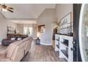 Inviting living room featuring vaulted ceilings, stylish floors, and modern decor at 121 Fox Wood Ct, Villa Rica, GA 30180