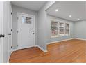 Welcoming entryway with hardwood floors, a white front door, and abundant natural light at 2002 Twin Falls Rd, Decatur, GA 30032