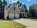 Beautiful two-story brick home with a two-car garage and well-maintained lawn at 2822 Salem Oak Way, Duluth, GA 30096
