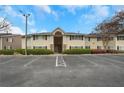 Apartment building with parking and manicured landscaping under a blue sky at 1468 Briarwood Ne Rd # 502, Brookhaven, GA 30319