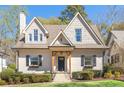 Charming home with a landscaped front yard, featuring black shutters and flower boxes, offering great curb appeal at 218 Garland Ave, Decatur, GA 30030