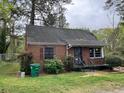 Cozy brick home with a quaint front yard, perfect for those seeking a starter home at 3095 Rainbow Dr, Decatur, GA 30034