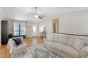 Cozy living room featuring hardwood floors, a comfortable sofa, and ample natural light at 3841 Admiral Dr, Atlanta, GA 30341