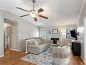 Comfortable living room featuring a brick fireplace and neutral decor at 3841 Admiral Dr, Atlanta, GA 30341