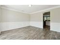 Open-concept dining room with white trim and hardwood floors at 93 Carriage Lake Dr, Stockbridge, GA 30281