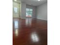 Bright living room with hardwood floors, fresh paint, and a large window offering lots of natural light at 3958 Wolcott Cir, Doraville, GA 30340