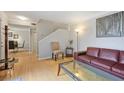 Comfortable living room featuring a fireplace, hardwood floors, and a seating area at 566 Trillum Sw Ct, Marietta, GA 30008