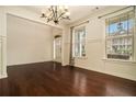 Bright living area featuring hardwood floors, large windows, and decorative molding, perfect for entertaining and relaxation at , Atlanta, GA 30318