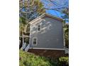 Exterior view of siding home with brick foundation at 234 Carlyle Park Ne Dr # 234, Atlanta, GA 30307