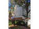 Siding home with brick foundation, small yard and manicured bushes at 234 Carlyle Park Ne Dr # 234, Atlanta, GA 30307