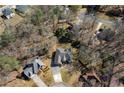 Aerial view of a residential neighborhood featuring lush trees and well-maintained homes at 1129 Annie Sw Ln, Mableton, GA 30126