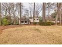Two-story home showcasing a well-maintained front yard and inviting curb appeal at 1417 Hickory Sw Dr, Lilburn, GA 30047