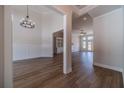 Inviting foyer with tall ceilings, modern lighting and hardwood flooring leading to open-concept living areas at 215 Pinewood Dr, Covington, GA 30014