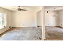 Spacious living room with large windows and ceiling fan providing ample natural light and comfort at 2348 Jones Nw Rd, Atlanta, GA 30318