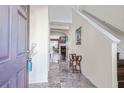 Inviting foyer with marble tile floors, staircase, and view into the living spaces at 2411 Heritage Park Nw Cir # 14, Kennesaw, GA 30144