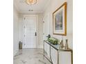 Welcoming foyer boasts marble floors, an elegant console table, and sophisticated decor at 2700 Paces Ferry Se Rd # 302, Atlanta, GA 30339