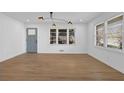 Sun-drenched living room boasts hardwood floors and fresh, neutral paint at 965 Carr Nw St, Atlanta, GA 30318