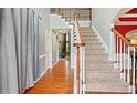 Spacious foyer with hardwood floors, a staircase, and neutral wall colors at 1536 Granby Ln, Locust Grove, GA 30248