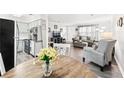 Open-concept living space with eat-in kitchen and hardwood floors at 3811 Lavilla Dr, Powder Springs, GA 30127