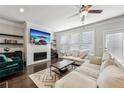 Cozy living room featuring a sleek fireplace, large windows, and comfortable seating arrangements at 4125 Barry Pl, Chamblee, GA 30341