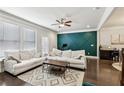 Bright living room with large windows, comfortable seating, hardwood floors, and accent wall at 4125 Barry Pl, Chamblee, GA 30341